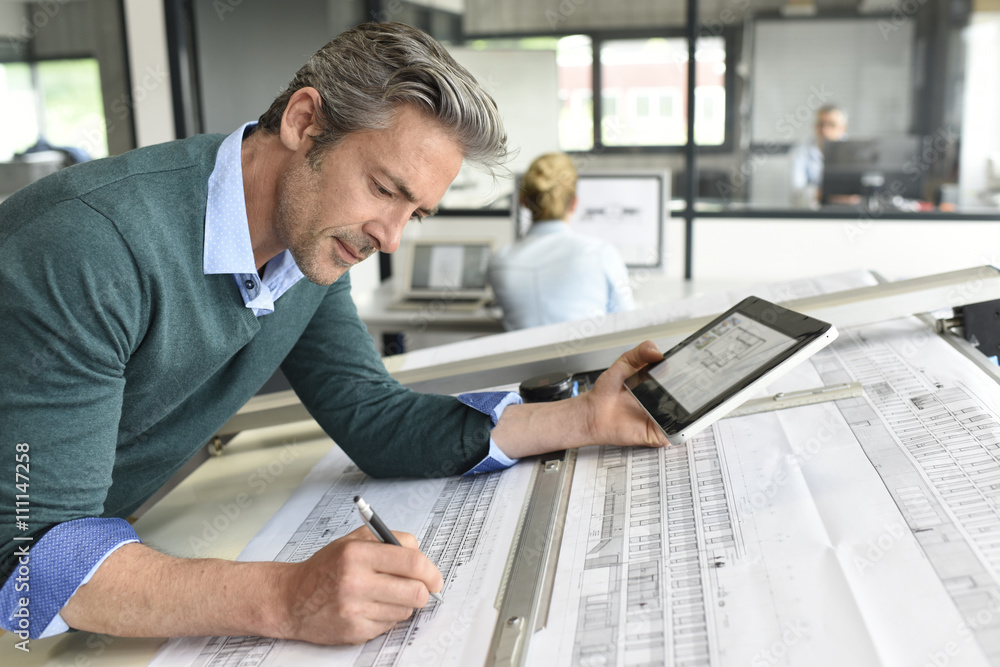 Architect working on project in office