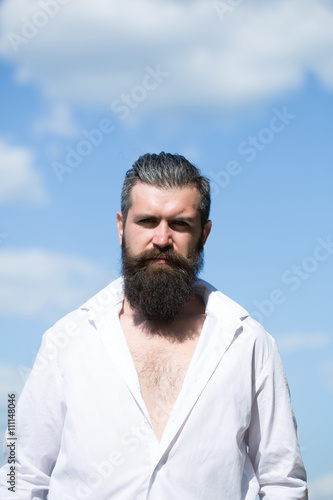 Bearded man on blue sky