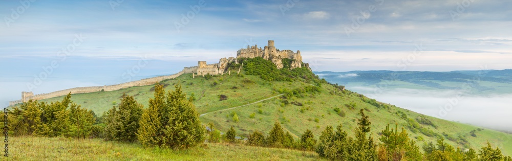 panorama with old castle on the hill in morning time