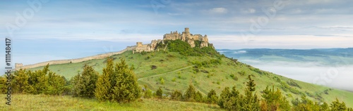 panorama with old castle on the hill in morning time