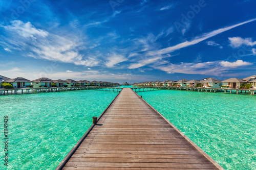 Beautiful water villas on the sea with the bridge, Maldives