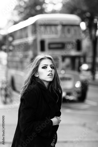 Stylish girl in street near bus © Volodymyr