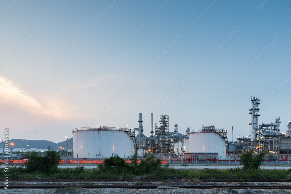 Oil Refinery factory at sunset Oil Refinery factory at sunset