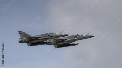 Pair of jet fighters in flight photo