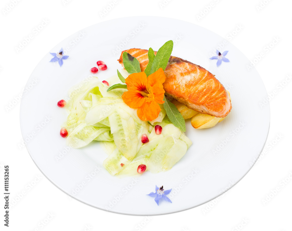 Grilled salmon fillet with sliced cucumbers. Grilled salmon fillet with sliced cucumbers.