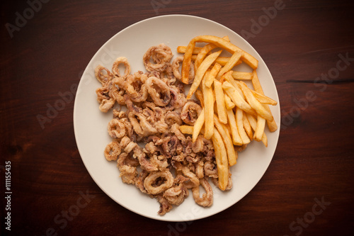 Fried calamari rings with fries