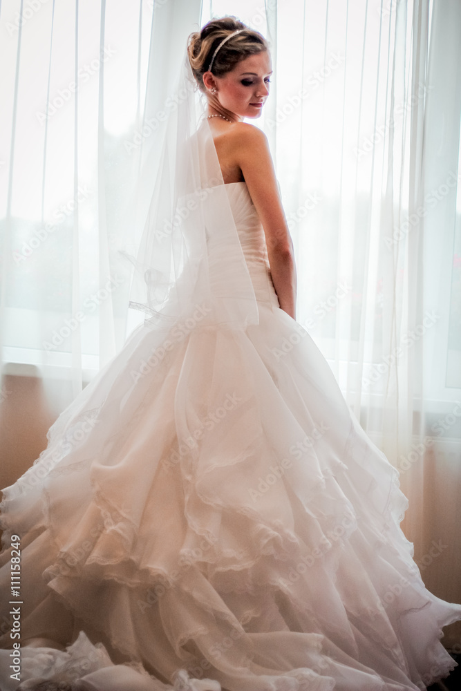Bride looks out of the window,wedding day Bride looks out of the window,wedding day