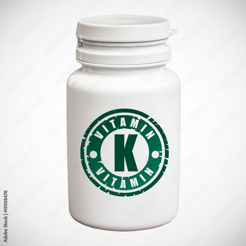 Bottle of pills with vitamin K Bottle of pills with vitamin K