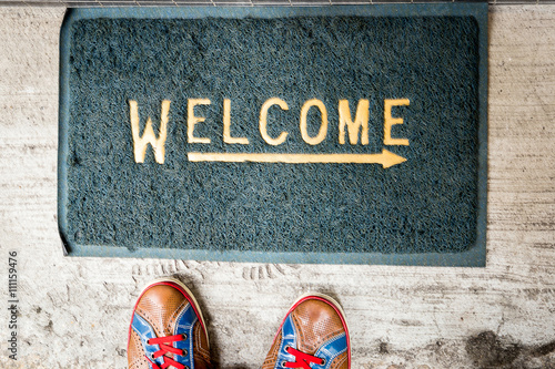 Tableau sur toile Welcome Carpet with Colorful Sneakers on it
