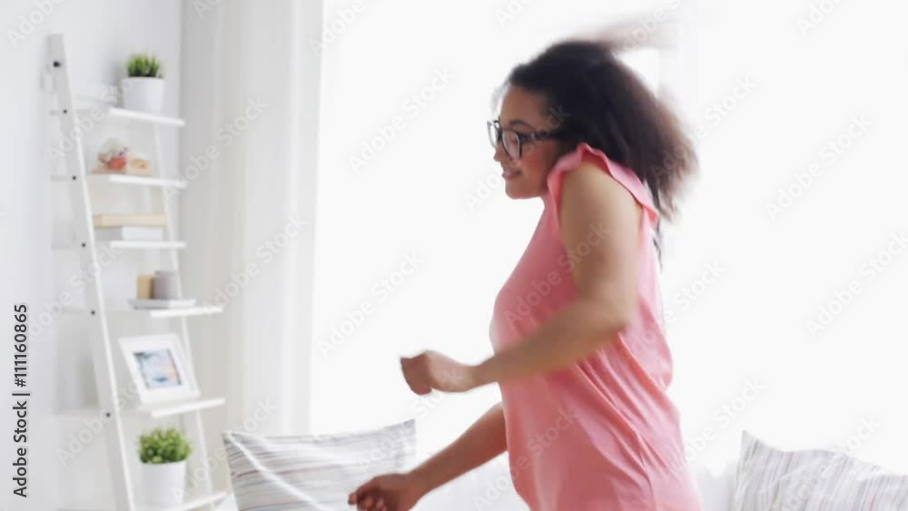 happy african american young woman dancing at home happy african american young woman dancing at home