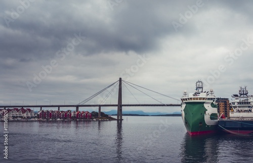 A beautiful view on Port with Ships and Bridge in Stavanger, Norway © toyechkina