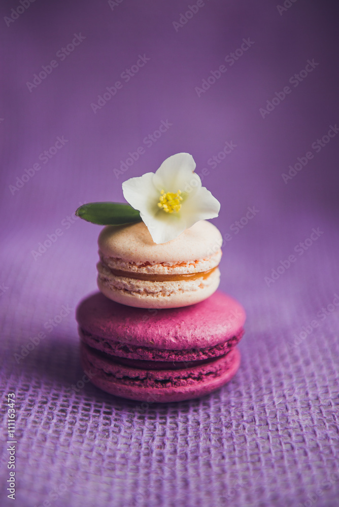 French macarons with white flowers French macarons with white flowers