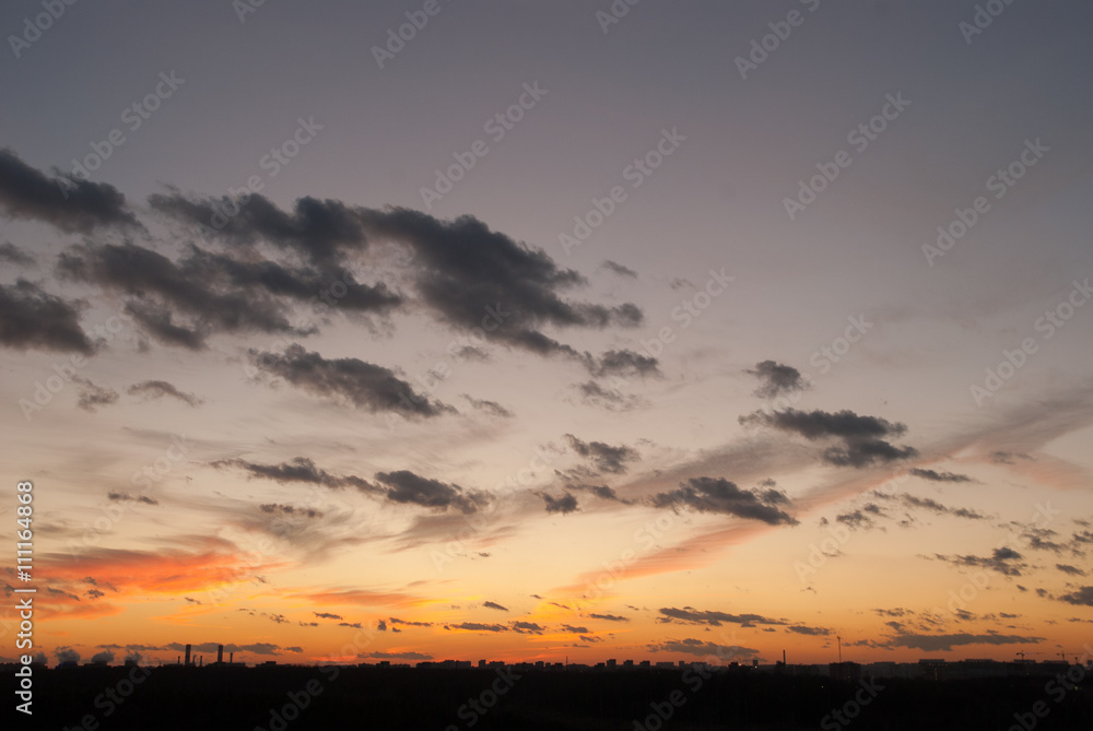 Natural background of colorful red sky during sunset time with street roofs Natural background of colorful red sky during sunset time with street roofs