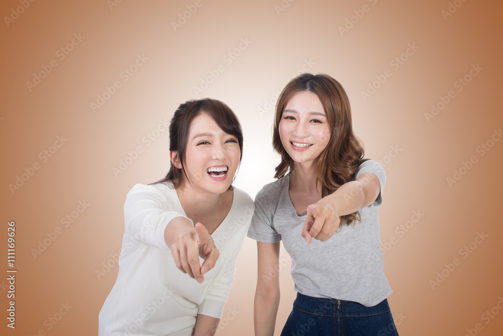 Asian woman laughing and pointing Asian woman laughing and pointing