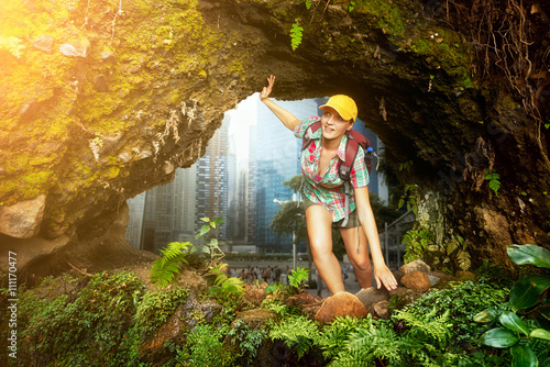 Wall Mural Woman hiker discovering a beautiful jungle