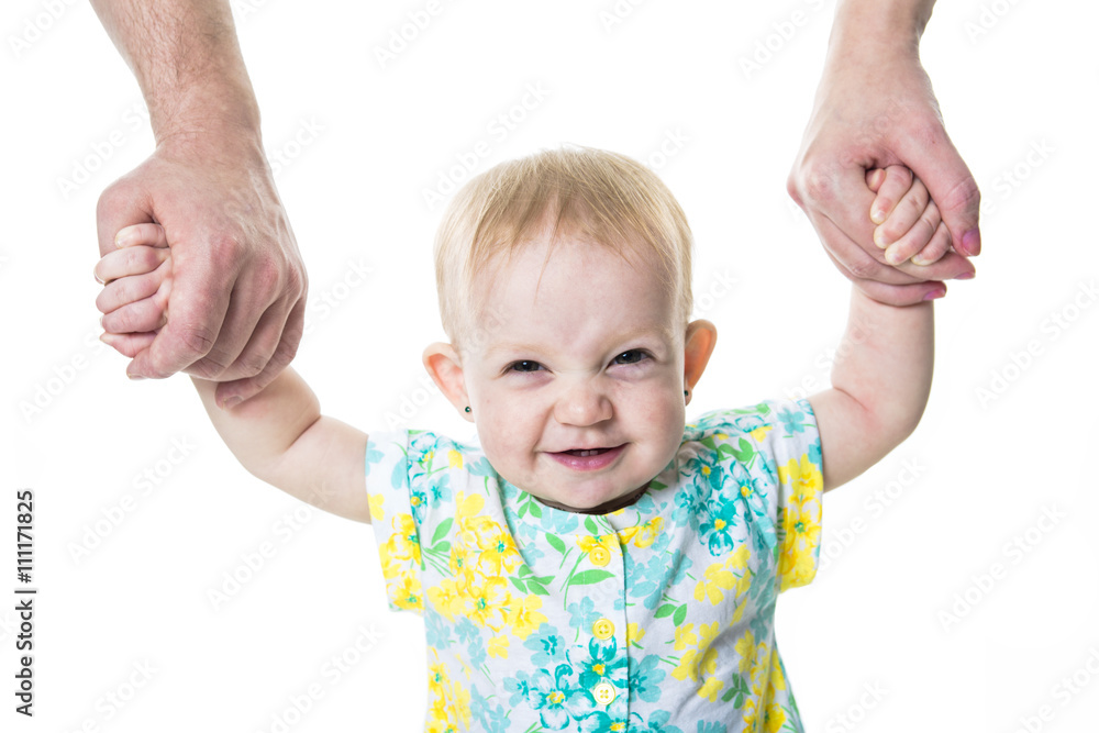baby taking first steps with mother father help on white background baby taking first steps with mother father help on white background