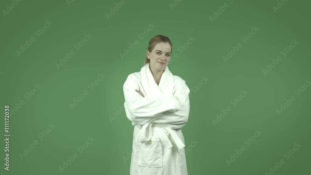attractive caucasian girl in bathrobe isolated on green smiling confident attractive caucasian girl in bathrobe isolated on green smiling confident