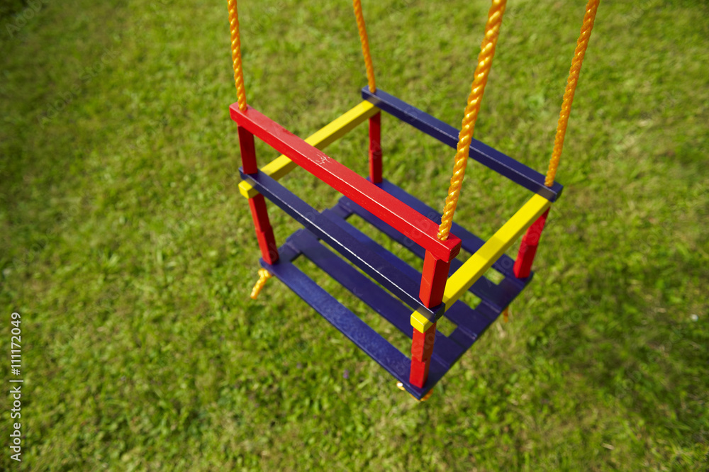 swing on an empty playground. Concept for child protection, abduction or loneliness swing on an empty playground. Concept for child protection, abduction or loneliness