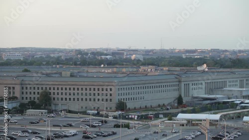 The Pentagon building and the airplane flying on the sky in Washington DC, USA.