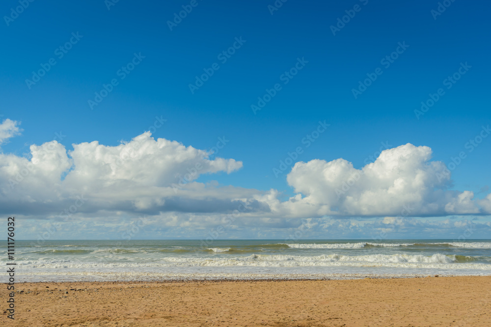 Clouds,surf and sand