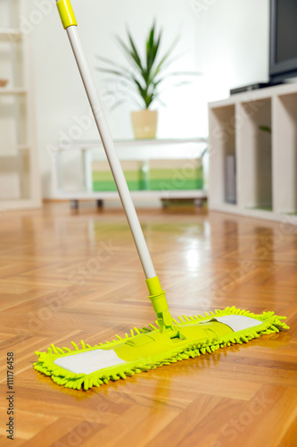 Cleaning the floor with a mop