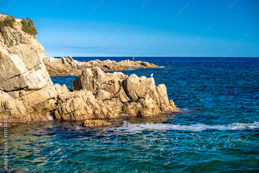 rocks on the shoreline in Lloret de Mar, Spain