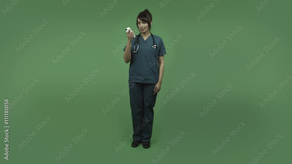 indian female doctor isolated on greenscreen happy with cell phone indian female doctor isolated on greenscreen happy with cell phone