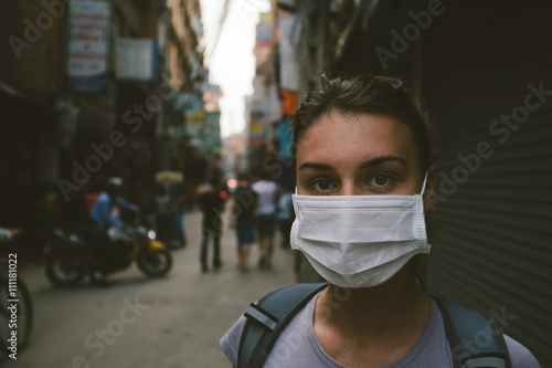 Young tourist girl with mask