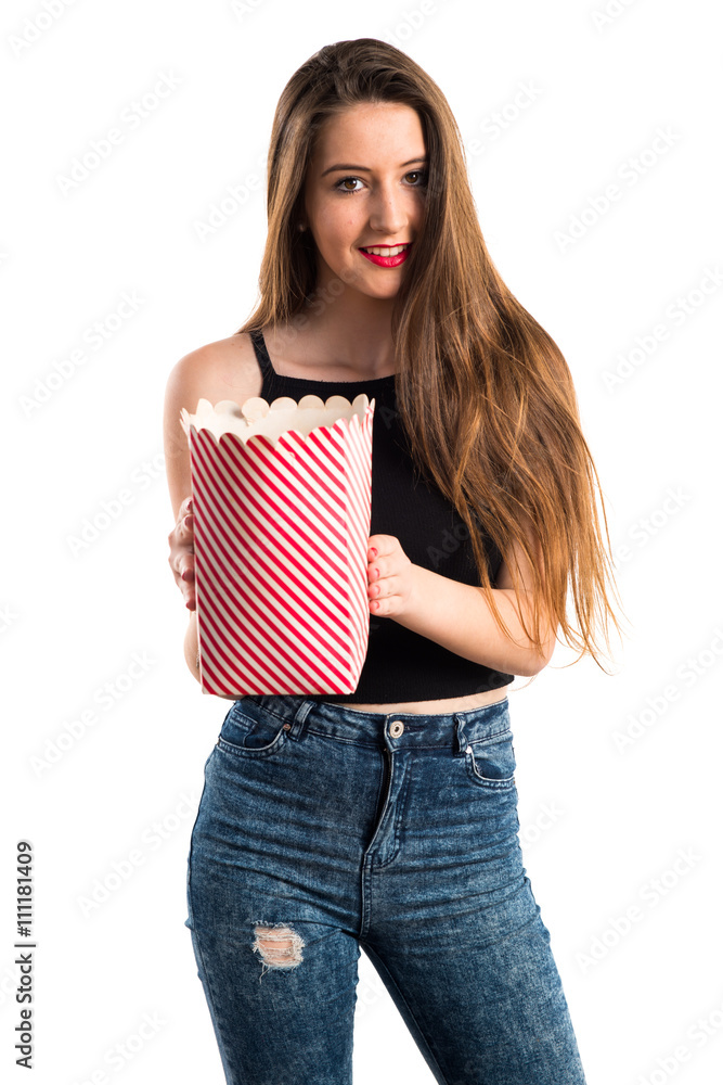 Young girl eating popcorns