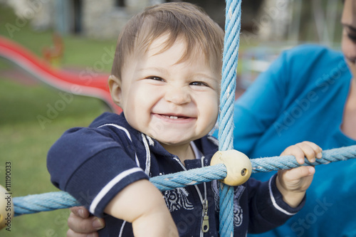 Canvastavla One year old baby smiling at playground