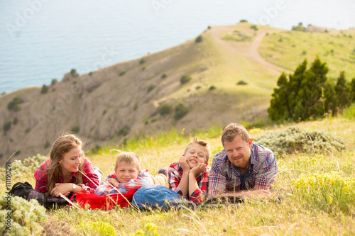 Family resting in mountains