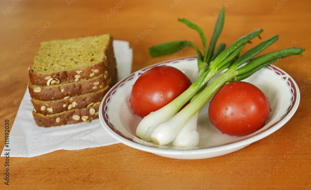 Fresh vegetables with greens and rye bread Fresh vegetables with greens and rye bread