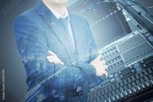 Double exposure of professional businessman with servers technol