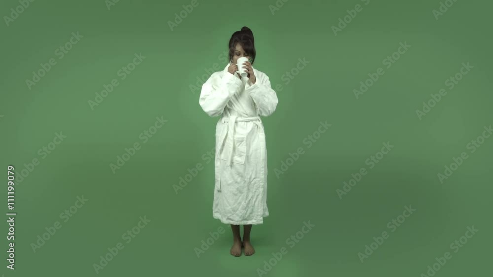 indian woman in bathrobe isolated on green relaxing coffee break indian woman in bathrobe isolated on green relaxing coffee break
