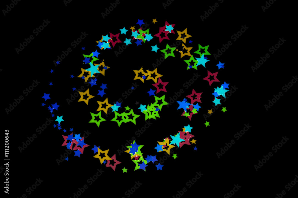 colorful stars on dark background.