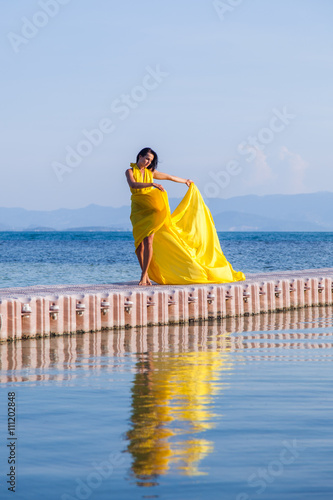 Woman in flying yellow dress