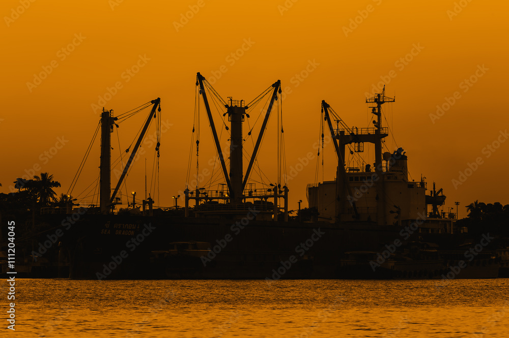 Sunset over dock ship or harbor near river