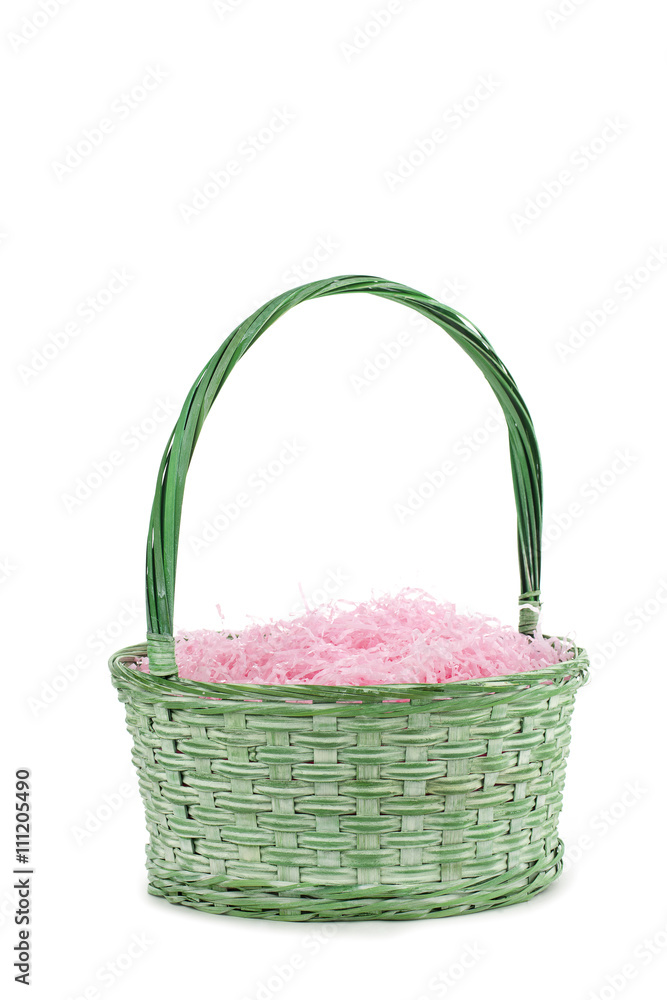 green basket and pink shredded papers.