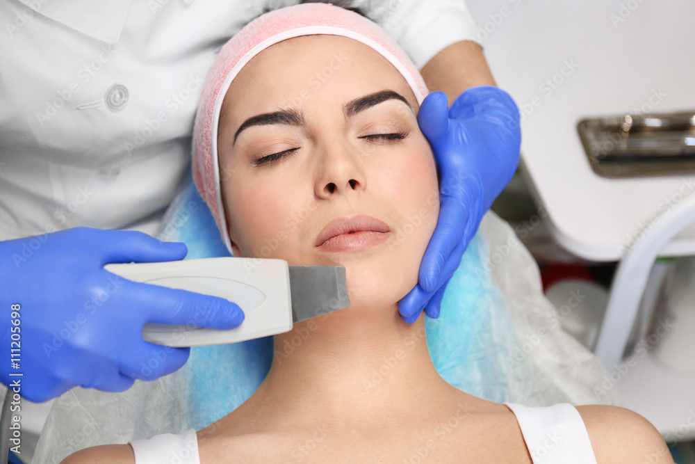 Young woman having face procedures in a beauty salon Young woman having face procedures in a beauty salon