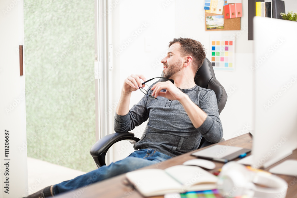 Fototapeta premium Thoughtful man taking a break from work