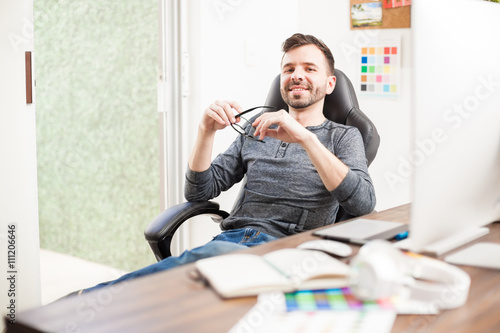 Graphic designer at his office desk © AntonioDiaz