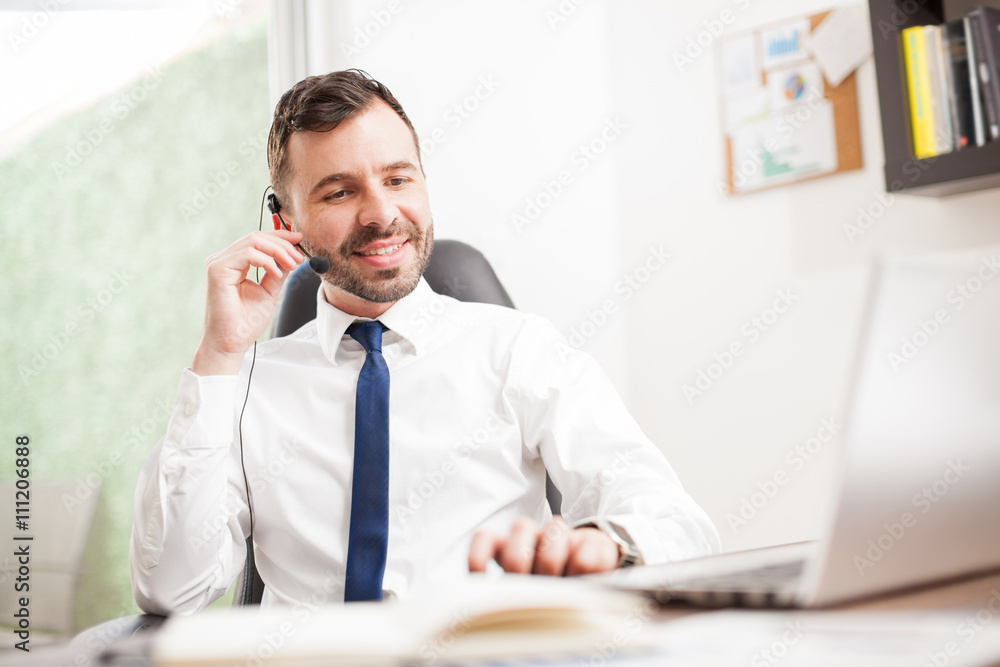 Businessman doing some sales over the phone Businessman doing some sales over the phone
