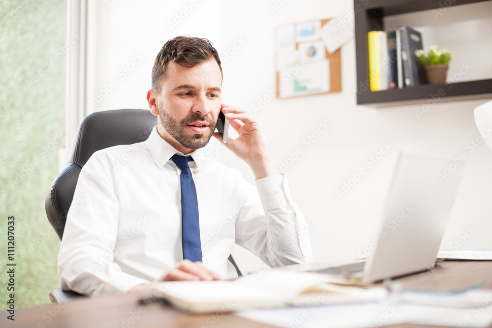Businessman in the middle of a phone call Businessman in the middle of a phone call