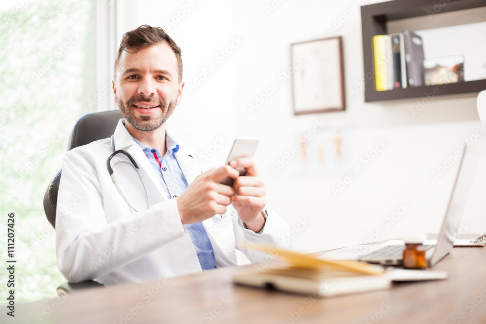 Doctor using social media on a smartphone