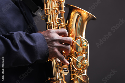 Photography African American jazz musician playing the saxophone, closeup