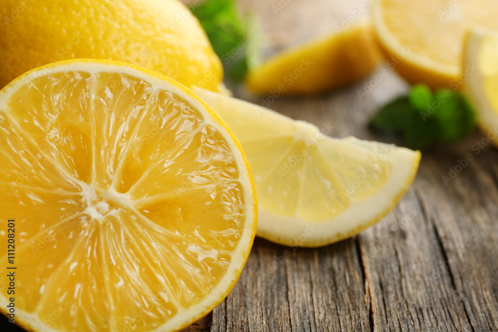 Slices of fresh lemons on wooden background Slices of fresh lemons on wooden background