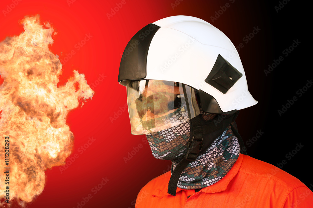Fototapeta premium Fire fighter on oil and gas industry, successful firefighter at work , Fire suit for fighter with fire and suit for protect fire fighter, Security team when fire case.