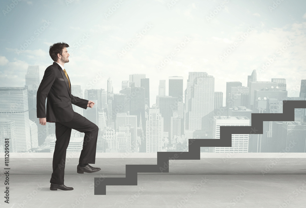 Business person in front of a staircase Business person in front of a staircase
