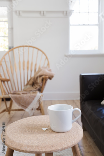 Focus on cup of tea in contemporary styled living room