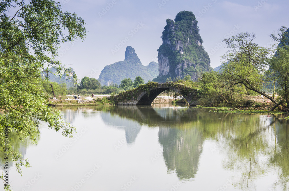 Fototapeta premium The beautiful karst mountains and rural scenery in spring